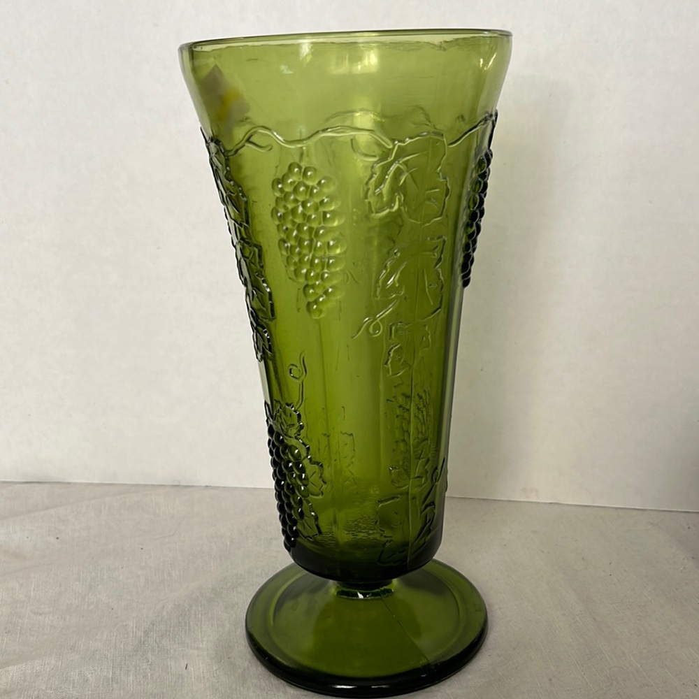 Pretty green glass Indiana Colony vase with Harvest Grape pattern.